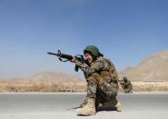 Zarmina Ahmadi, 22, a female soldier from the Afghan National Army (ANA) aims her rifle during a military exercise at the Kabul Military Training Centre (KMTC) in Kabul, Afghanistan October 26, 2016. REUTERS/Mohammad Ismail