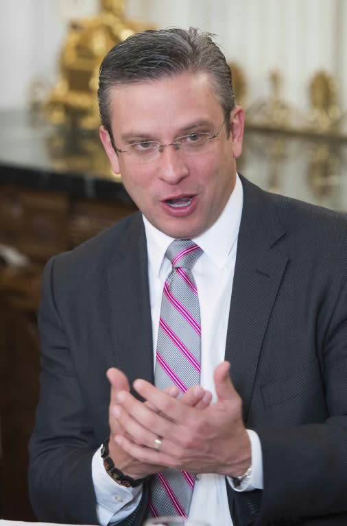 Puerto Rico Governor Alejandro García Padilla gestures as he speaks during a meeting of the National Governors Association at the White House in Washington, DC, February 23, 2015