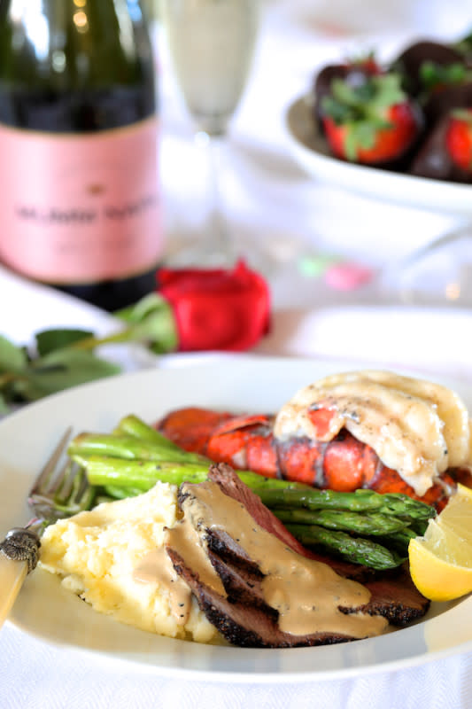 <p>From A Chef's Kitchen</p><p>It doesn't get more romantic than a classic steak and lobster dinner. This Steak au Poivre and Broiled Lobster Tail with Roasted Asparagus is the perfect, easy, elegant, romantic restaurant-quality meal you and your lover will both love!</p><p><strong>Get the recipe: <a href="https://www.fromachefskitchen.com/steak-au-poivre-lobster-asparagus/" rel="nofollow noopener" target="_blank" data-ylk="slk:Steak au Poivre and Broiled Lobster Tail with Roasted Asparagus;elm:context_link;itc:0;sec:content-canvas" class="link rapid-noclick-resp">Steak au Poivre and Broiled Lobster Tail with Roasted Asparagus</a></strong></p>