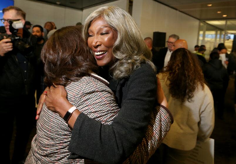 Los Angeles, CA - Cynthia McClain-Hill, center, hugs a co-worker after stepping down as president of the Los Angeles Department of Water and Power during a board meeting on Tuesday, Jan. 9, 2023. (photographer} / Los Angeles Times)
