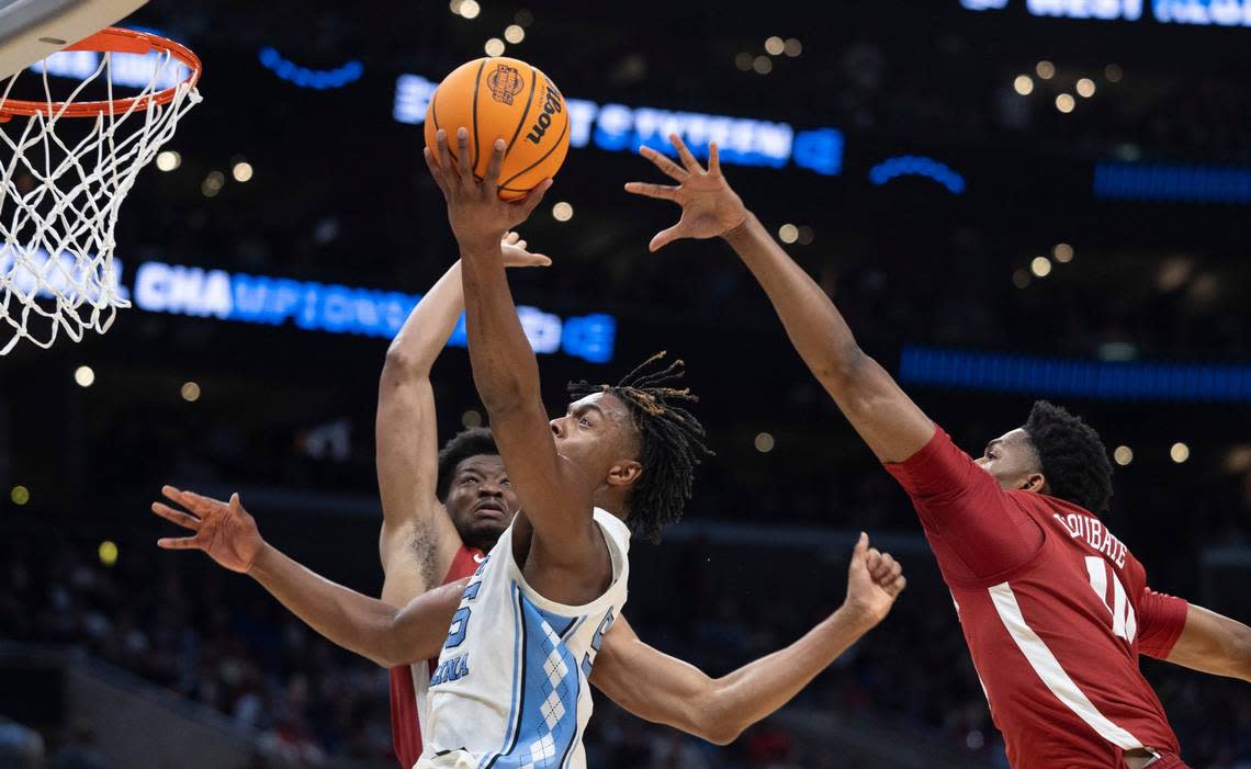 North Carolina’s Harrison Ingram (55) drives to the basket between Alabama’s Mohamed Wague (11) and Mouhamed Dioubate (10) in the first half against North Carolina in the NCAA Sweet Sixteen on Thursday, March 28, 2024 at Crypto.com Arena in Los Angeles, CA