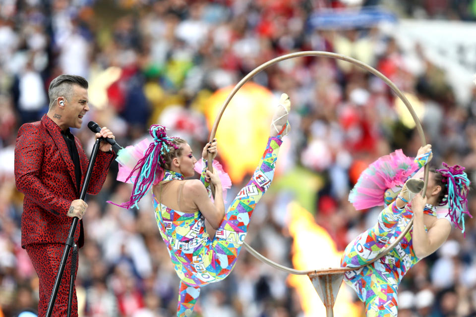 <p>English singer Robbie Williams (C) performs during the Opening Ceremony before the Russia 2018 World Cup Group A football match between Russia and Saudi Arabia at the Luzhniki Stadium in Moscow on June 14, 2018. (Photo by Kirill KUDRYAVTSEV / AFP) / RESTRICTED TO EDITORIAL USE – NO MOBILE PUSH ALERTS/DOWNLOADS (KIRILL KUDRYAVTSEV/AFP/Getty Images) </p>