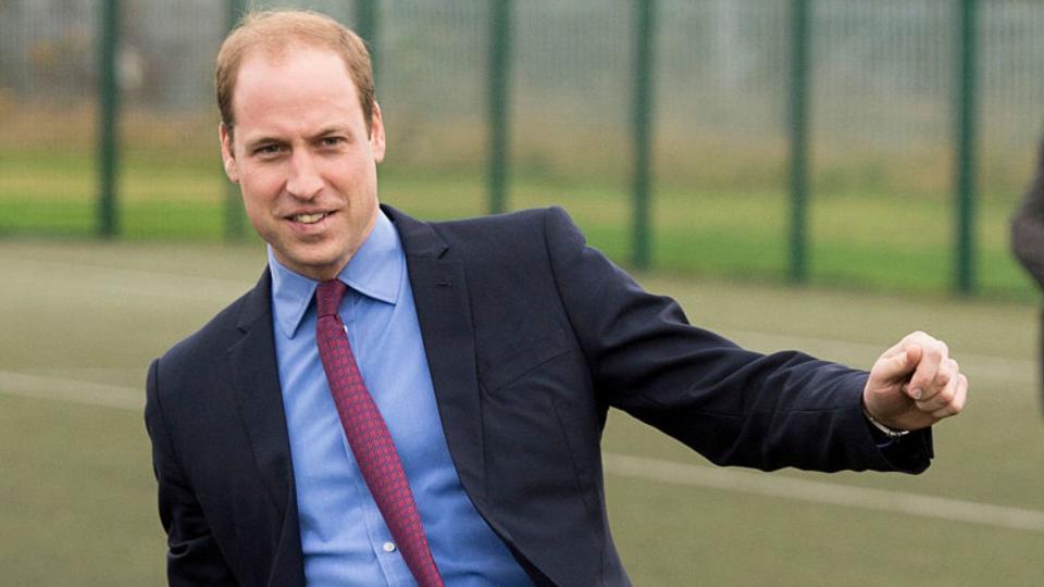 rince William  takes a penalty kick during a visit to The Football for Peace initiative in England