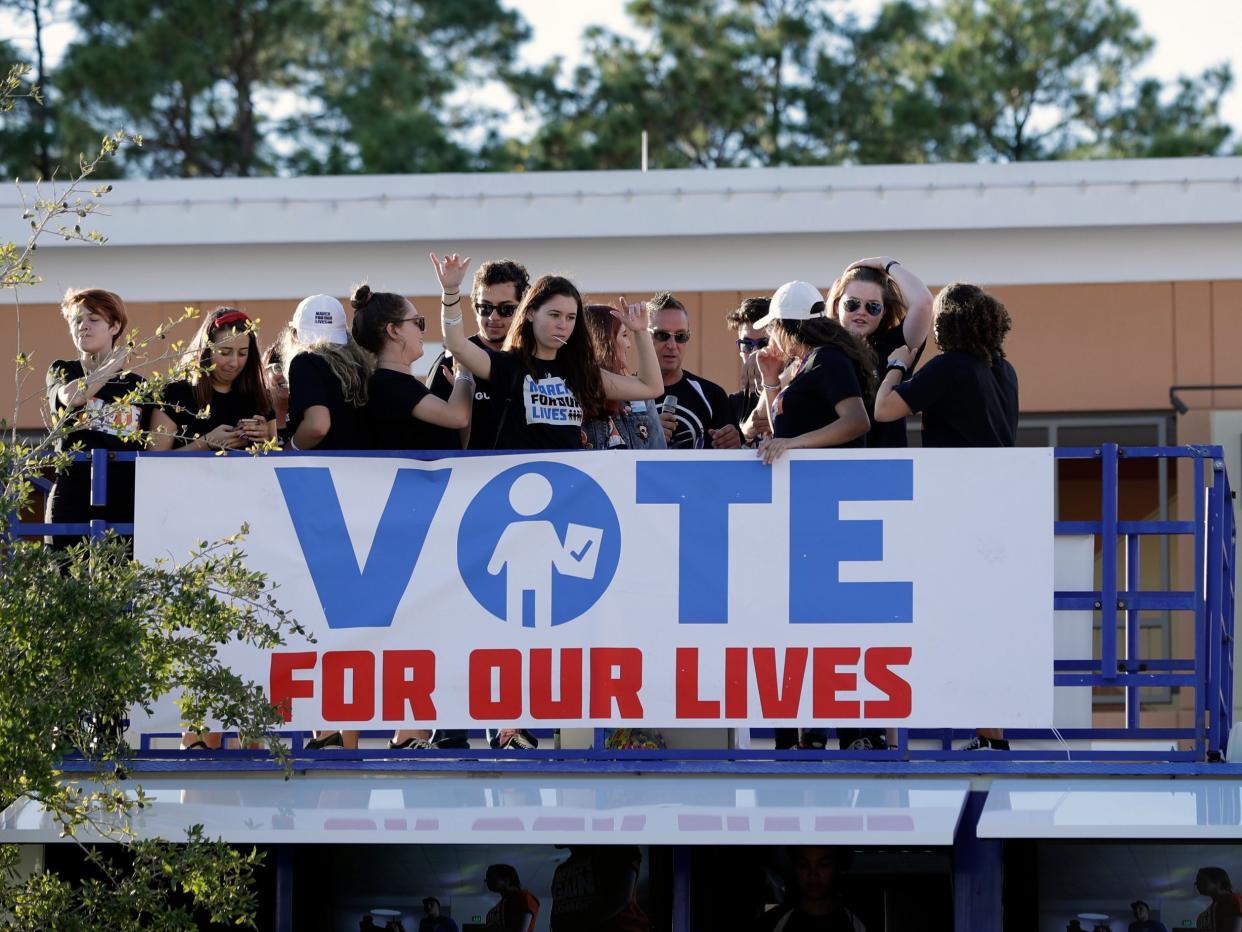 Students on top of a bus during a Vote for Our Lives rally at the University of Central Florida in Orlando: AP