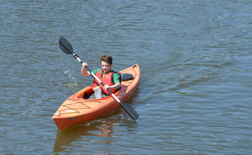 Cameron Zanchi, 14, of Douglas, paddles down the Swan River in Dennis Port. He and his family rented kayaks from Cape Cod Waterways on Sunday. Cape Cod Waterways offers kayak, stand up paddleboard, canoe and pedal boat rentals on the Swan River.