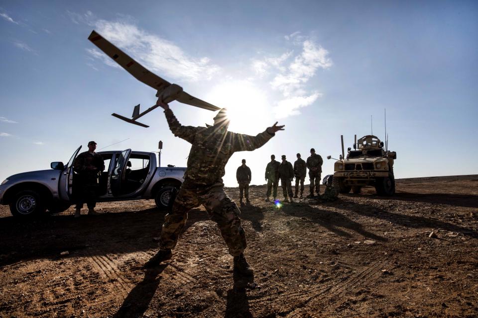 Air Force Tech Sgt. Matthew Coutts launches a Raven B Digital Data Link drone during a demonstration in Southwest Asia, Jan. 24, 2018.