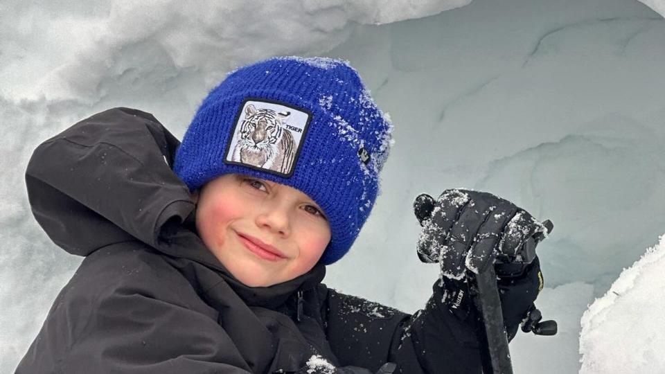 boy playing in snow 