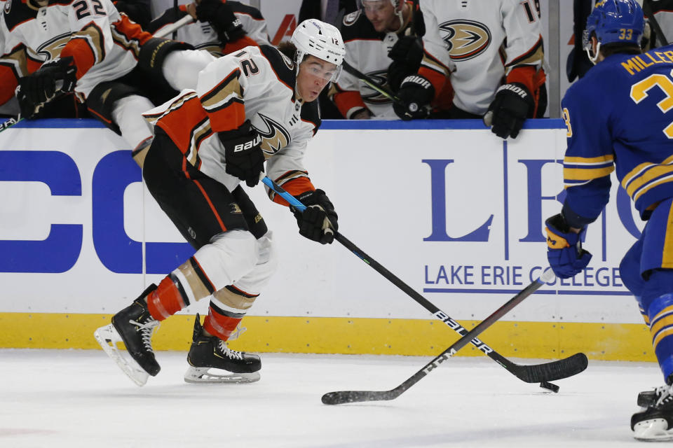 Anaheim Ducks left wing Sonny Milano (12) skates with the puck during the second period of an NHL hockey game against the Buffalo Sabres, Tuesday, Dec. 7, 2021, in Buffalo, N.Y. (AP Photo/Jeffrey T. Barnes)