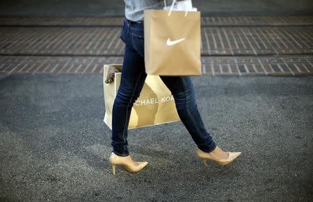 A woman shops at The Grove mall in Los Angeles November 26, 2013. REUTERS/Lucy Nicholson