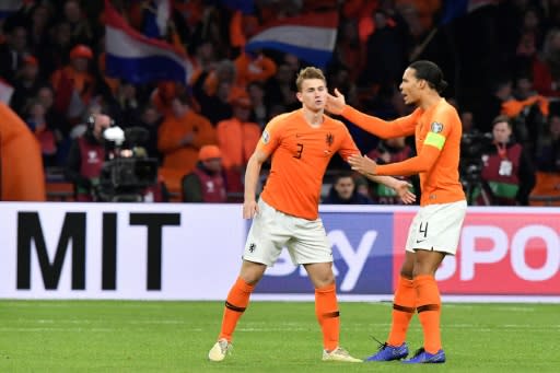 Netherlands defender Matthijs De Ligt is congratulated by Virgil Van Dijk after scoring