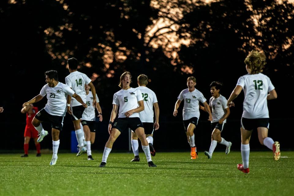 Zeeland West celebrates their comeback win over Holland Tuesday, Sept. 6, 2022, at Holland High School. 