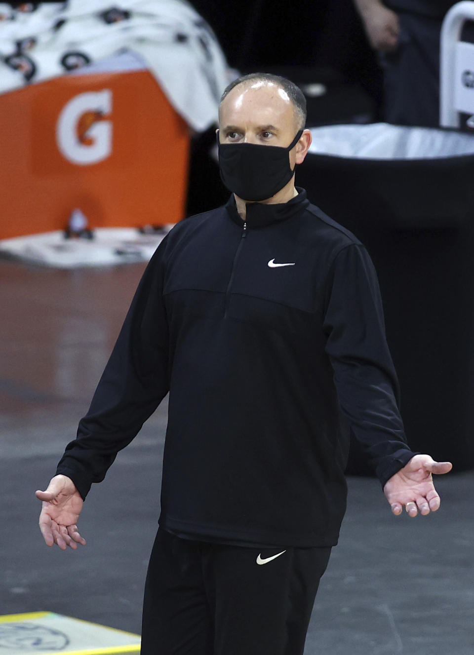 Oregon State head coach Scott Rueck talks with an official during an NCAA college basketball game in the first round of the Pac-12 women's tournament Wednesday, March 3, 2021, in Las Vegas. (AP Photo/Isaac Brekken)