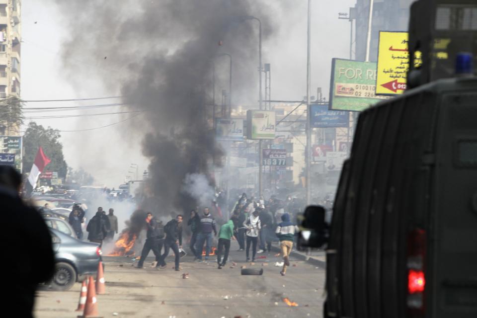 Egyptian security forces clash with supporters of ousted President Mursi at Nasr City district in Cairo