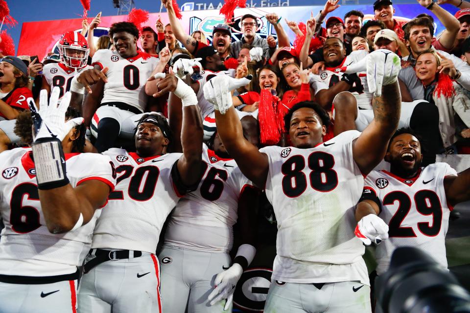 Georgia players celebrate their 34-7 victory over Florida last year.