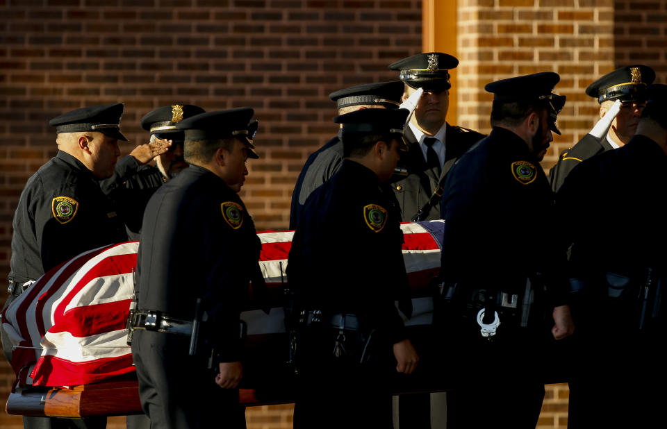 Pallbearers carry the casket of Houston Police Sgt. Christopher Brewster, Thursday, Dec. 12, 2019, at Grace Church Houston in Houston. Brewster, 32, was gunned down Saturday evening, Dec. 7, while responding to a domestic violence call in Magnolia Park. Police arrested 25-year-old Arturo Solis that night in the shooting death. Solis faces capital murder charges. (Godofredo A. Vásquez/Houston Chronicle via AP)