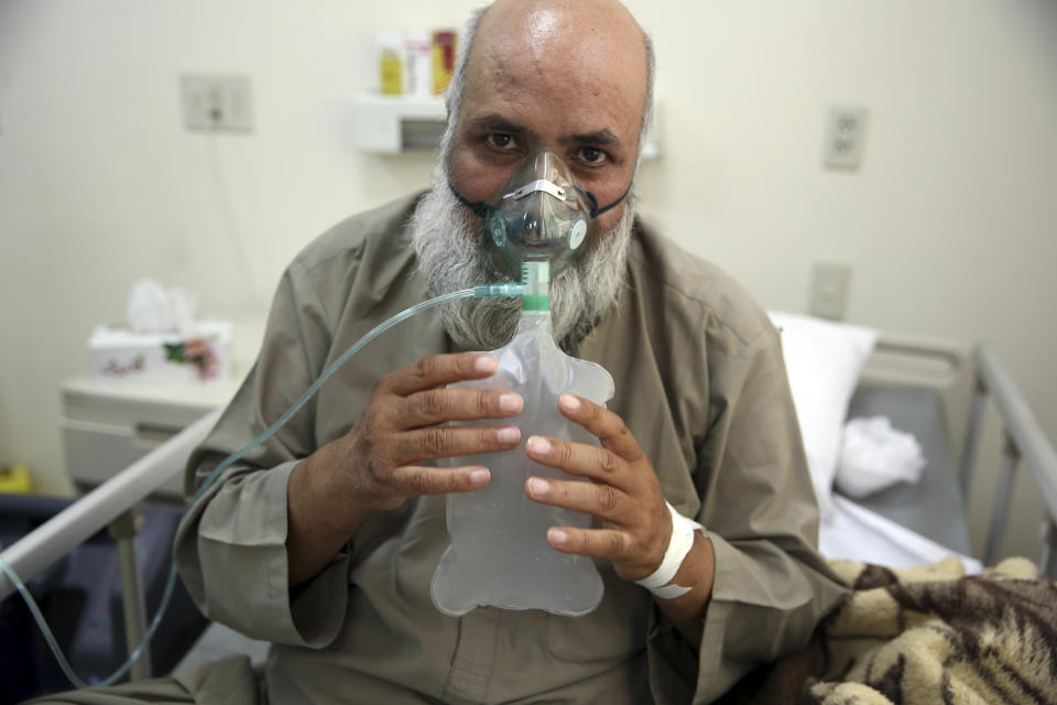 A patient is connected to an oxygen tank in the Intensive Care Unit ward for COVID-19 patients at the Afghan-Japan Communicable Disease Hospital in Kabul, Afghanistan, Tuesday June 30, 2020. (AP Photo/Rahmat Gul)