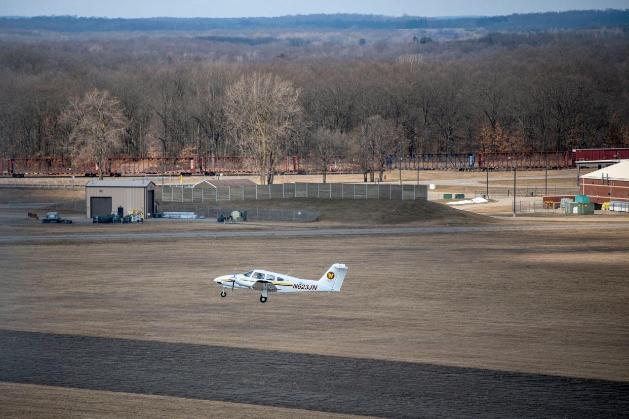 Western Michigan University students practice touch-and-goes on the runway at Battle Creek Executive Airport on Thursday, March 10, 2022.