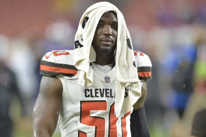 FILE - Cleveland Browns defensive end Chris Smith walks off the field following a preseason game against the Buffalo Bills in 2018.