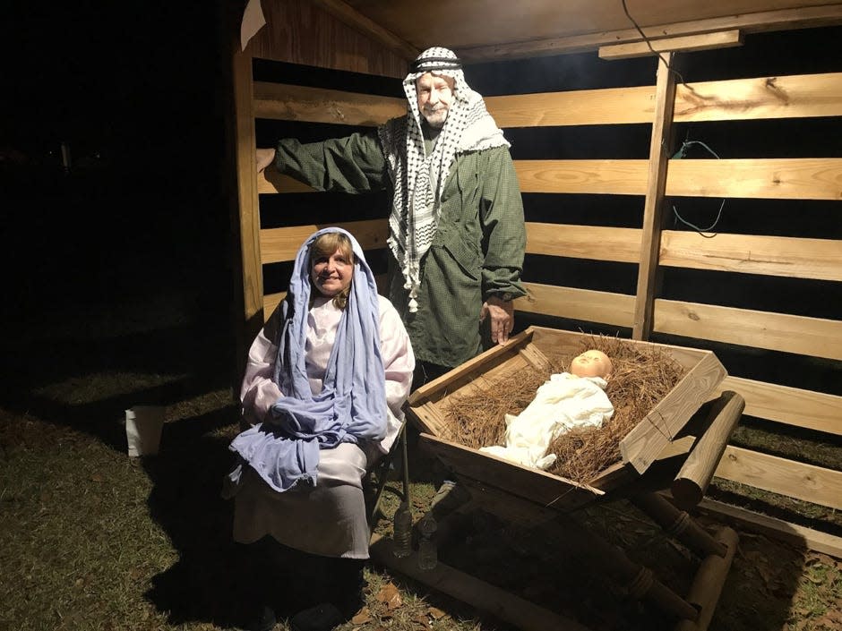 At the end of their "journey to Bethlehem," visitors to the Laurel Hill Presbyterian Church's 2020 Living Nativity reach the manger, where Mary and Joseph, portrayed by Tammie Becker and Rémy Kublick, shared their miraculous story.