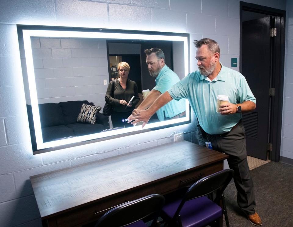 Pensacola Bay Center Executive Director Michael Capps shows off some of the improvements to the dressing rooms to venues made during a tour of the facility on Thursday, Aug. 17, 2023.