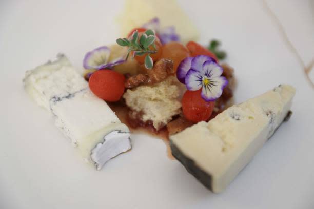 American Artisanal Cheeses are presented during a media preview ahead of the State Dinner in honor of French president Emmanuel Macron, in the State Dining Room of the White House in Washington, DC, on 30 November 2022 (AFP via Getty Images)