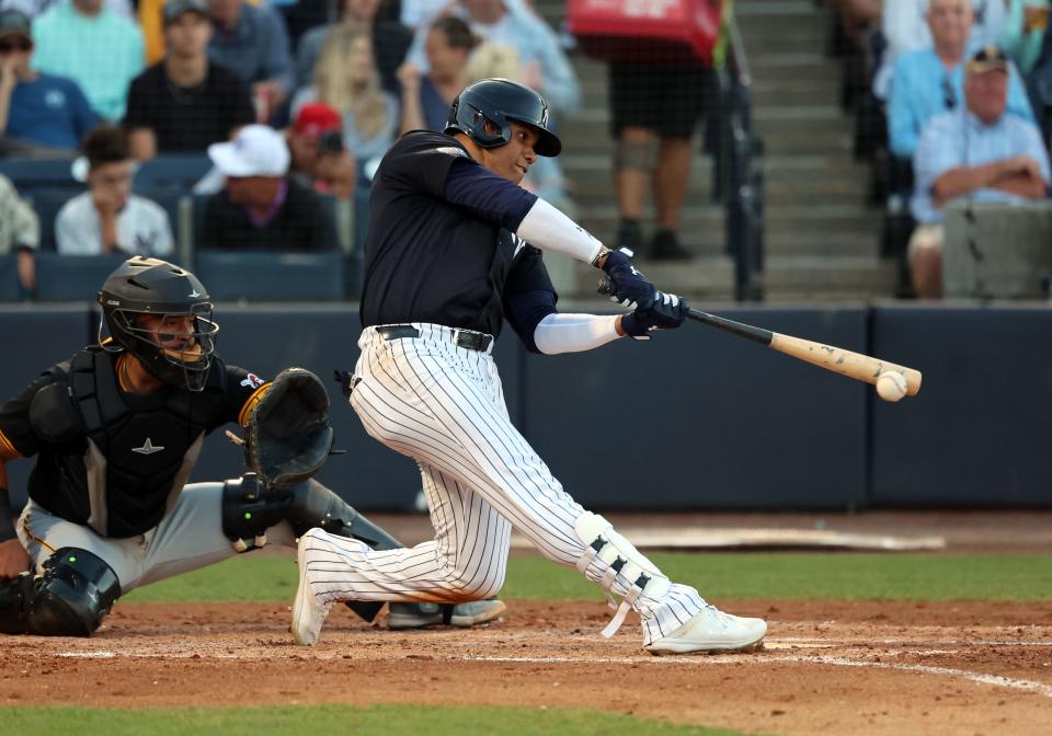 Mar 20, 2024; Tampa, Florida, USA; New York Yankees left fielder Juan Soto (22) doubles during the second inning against the Pittsburgh Pirates at George M. Steinbrenner Field. Mandatory Credit: Kim Klement Neitzel-USA TODAY Sports