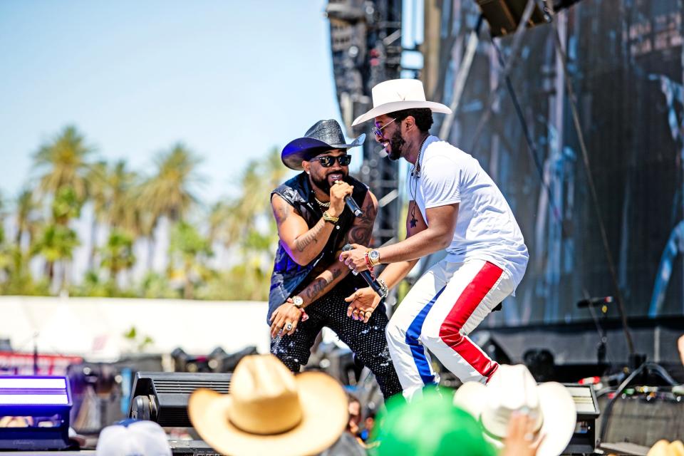 Randy Savvy of the Compton Cowboys, left, joins Willie Jones on the Mane Stage during Stagecoach in Indio, Calif., on Sunday, April 28, 2024.