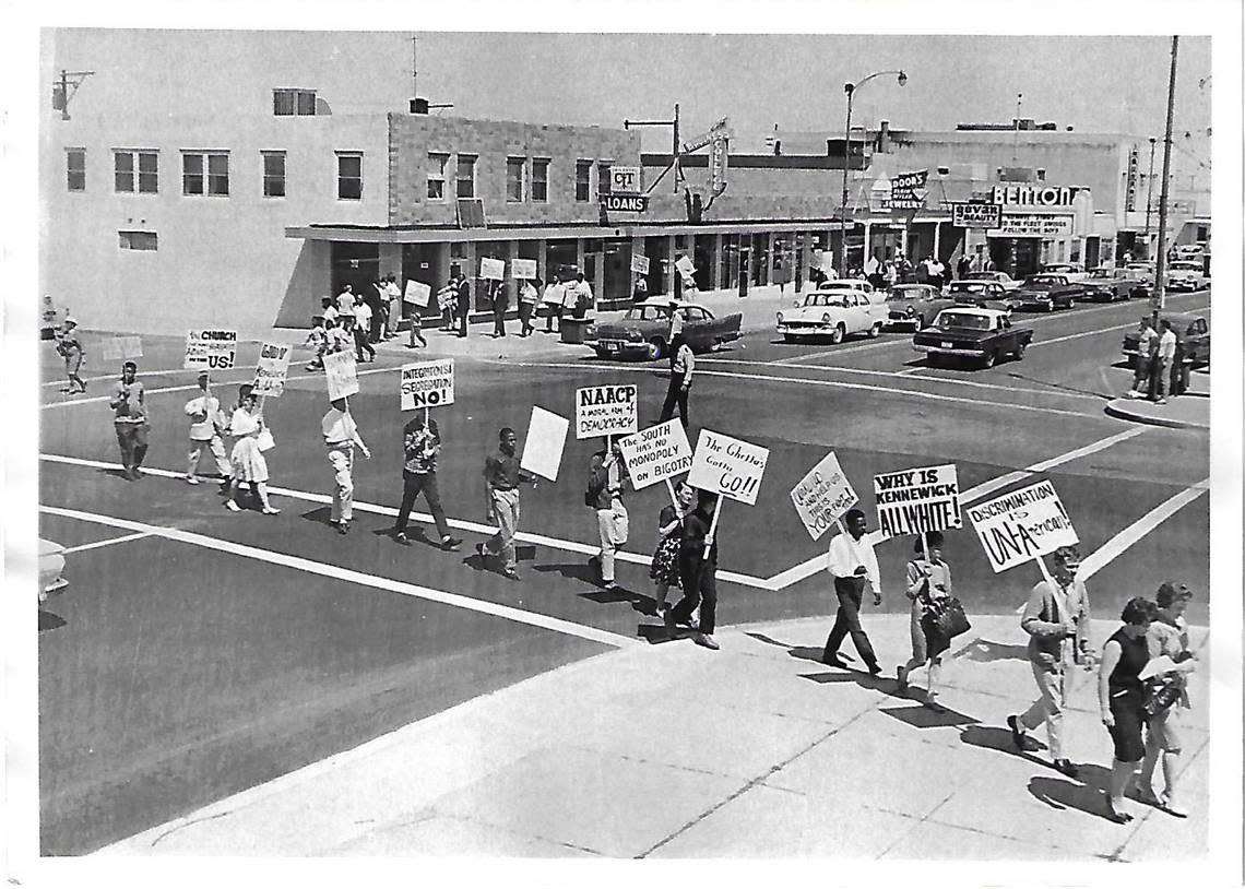 Protesters march through Kennewick in 1963 to draw attention to segregated housing in the Tri-Cities and policies that prevented Blacks from living in Kennewick.