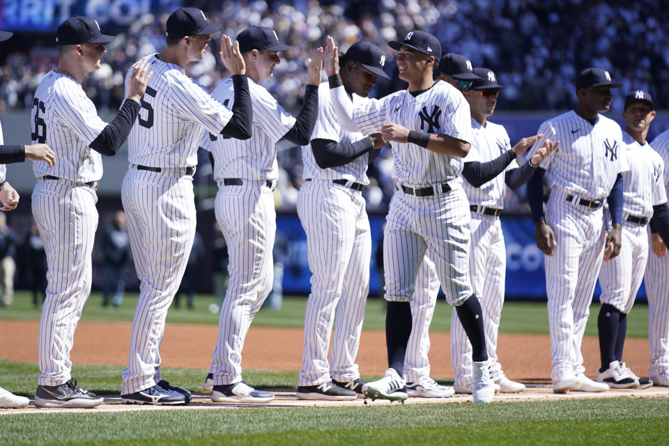 New York Yankees' Anthony Volpe greets teammates during introductions before the opening day baseball game against the San Francisco Giants at Yankee Stadium Thursday, March 30, 2023 in New York. (AP Photo/Seth Wenig)