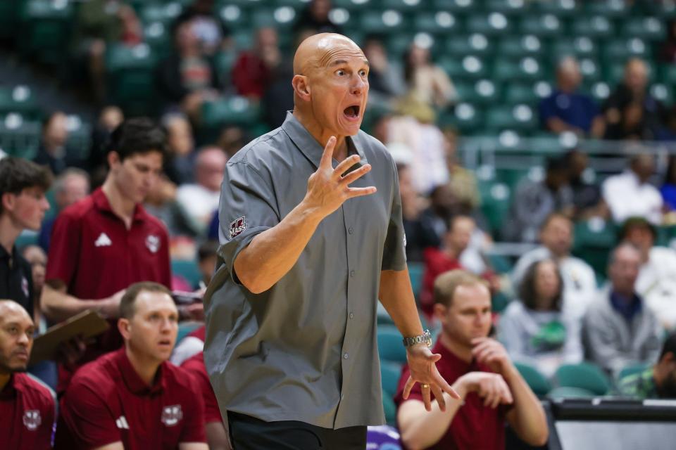 Head coach Frank Martin of the Massachusetts Minutemen yells to his players during the second half of their game against the Georgia Tech Yellow Jackets in the Diamond Head Classic in Hawaii last December.