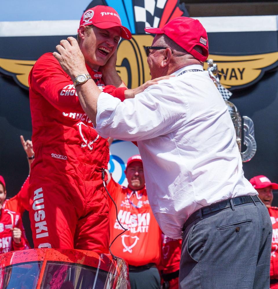 Driver Marcus Ericsson, left, celebrates with team owner Chip Ganassi after winning the 106th running of the Indianapolis 500 on May 29, 2022.