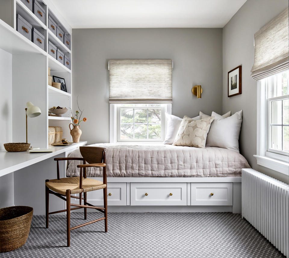 home office / guest bedroom with single day bed and built-in millwork with desk