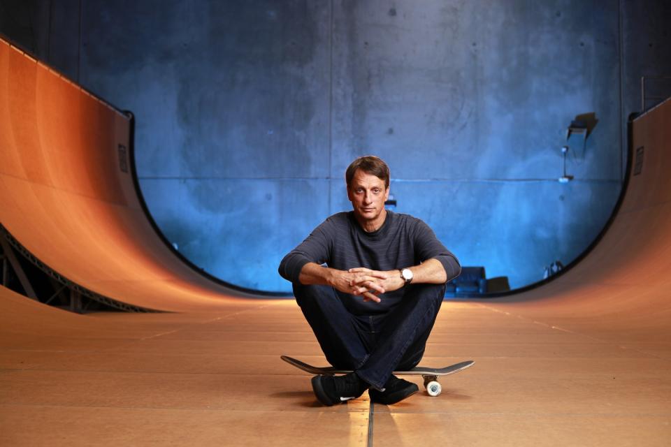 Tony Hawk sits on a ramp at his warehouse in Vista, Calif., on Aug. 31, 2020