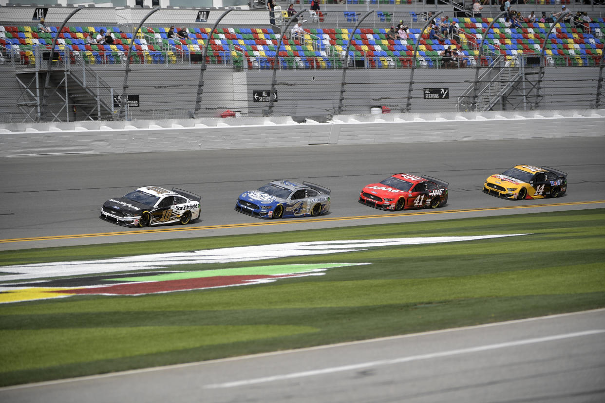 Aric Almirola (10), Kevin Harvick (4), Cole Custer (41) and Clint Bowyer (14) make their way along the front stretch during a practice session for a NASCAR Daytona 500 auto race at Daytona International Speedway, Saturday, Feb. 15, 2020, in Daytona Beach, Fla. (AP Photo/Phelan M. Ebenhack)