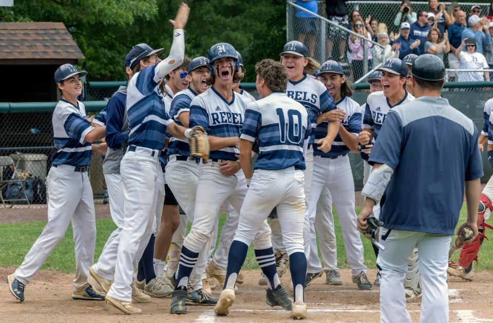 Howell's Thomas Strauch celebrates with his teammates after his two-run homer in the top of the first in Howell's 9-8 win over Hunterdon Central in the NJSIAA Group 4 championship game.