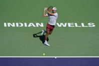 Tomas Machac, of the Czech Republic, returns a shot against Daniil Medvedev, of Russia, at the BNP Paribas Open tennis tournament Saturday, March 12, 2022, in Indian Wells, Calif. (AP Photo/Marcio Jose Sanchez)