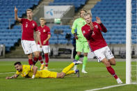 Norway's Erling Braut Haaland, right, celebrates after scoring, during the UEFA Nations League soccer match between Norway and Romania at Ullevaal Stadium, in Oslo, Sunday, Oct. 11, 2020, (Stian Lysberg Solum /NTB scanpix via AP)