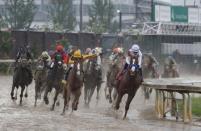 May 5, 2018; Louisville, KY, USA; Mike Smith aboard Justify (7) leads the field during the 144th running of the Kentucky Derby at Churchill Downs. Mandatory Credit: Brian Spurlock-USA TODAY Sports