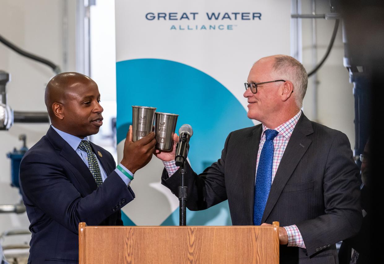 Cavalier Johnson, City of Milwaukee Mayor, left, toasts with Shawn Reilly, City of Waukesha Mayor, during a gathering to celebrate the completion of Waukesha's Lake Michigan Water Project at the new Booster Pumping Station in Waukesha, Wis. on Thursday, Sept. 7, 2023.