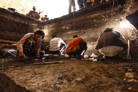 Archaeological excavations of Holocene deposits at Liang Bua on the Indonesian island of Flores are seen in progress in this undated handout picture courtesy of the Liang Bua Team. REUTERS/Liang Bua Team/Handout via Reuters