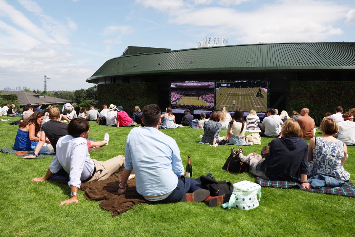 Fans claim a place on the hill after arriving early on Monday (Getty)