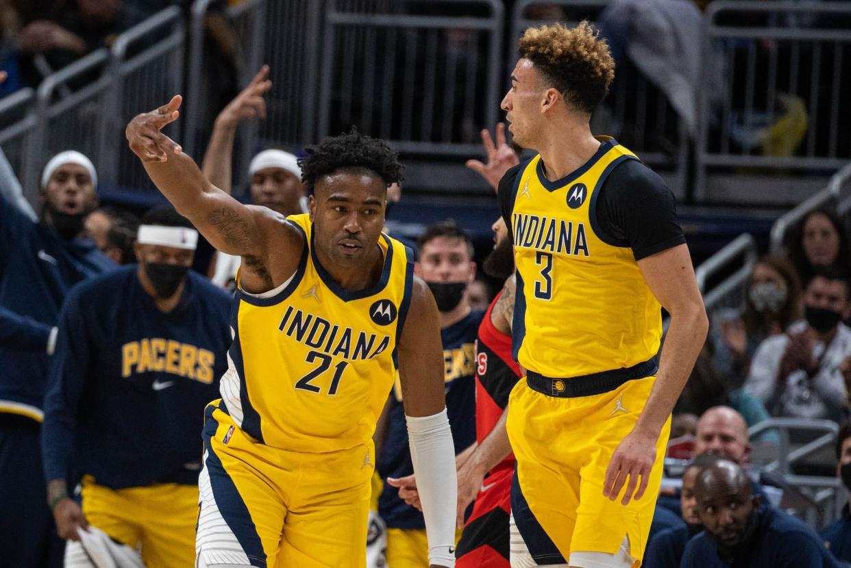 Nov 26, 2021; Indianapolis, Indiana, USA; Indiana Pacers guard Kelan Martin (21) celebrates a basket in the first half against the Toronto Raptors at Gainbridge Fieldhouse. Mandatory Credit: Trevor Ruszkowski-USA TODAY Sports