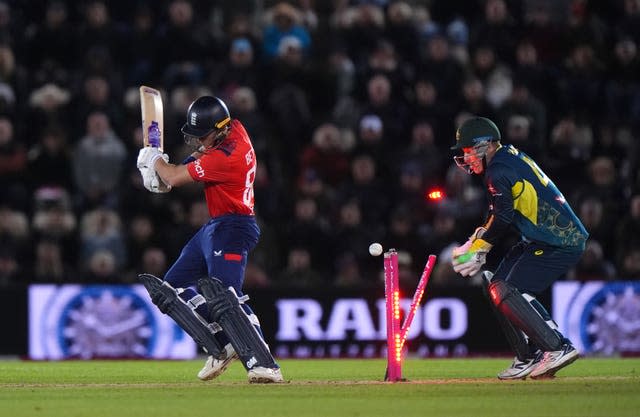 Jacob Bethell, left, is bowled by Australia's Adam Zampa