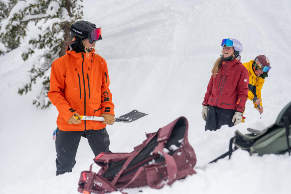 Athletes Jess Hotter (orange jacket), Piper Kunst (red jacket), and Jake Kunst (yellow jacket) put their shovels to work on one of the Silver Belt's many enhanced features.<p>Credit: Sugar Bowl Resort</p>
