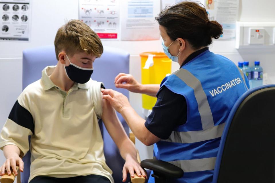 Teen receives his first dose of the Covid-19 vaccine at the Citywest vaccination centre in Dublin (PA)