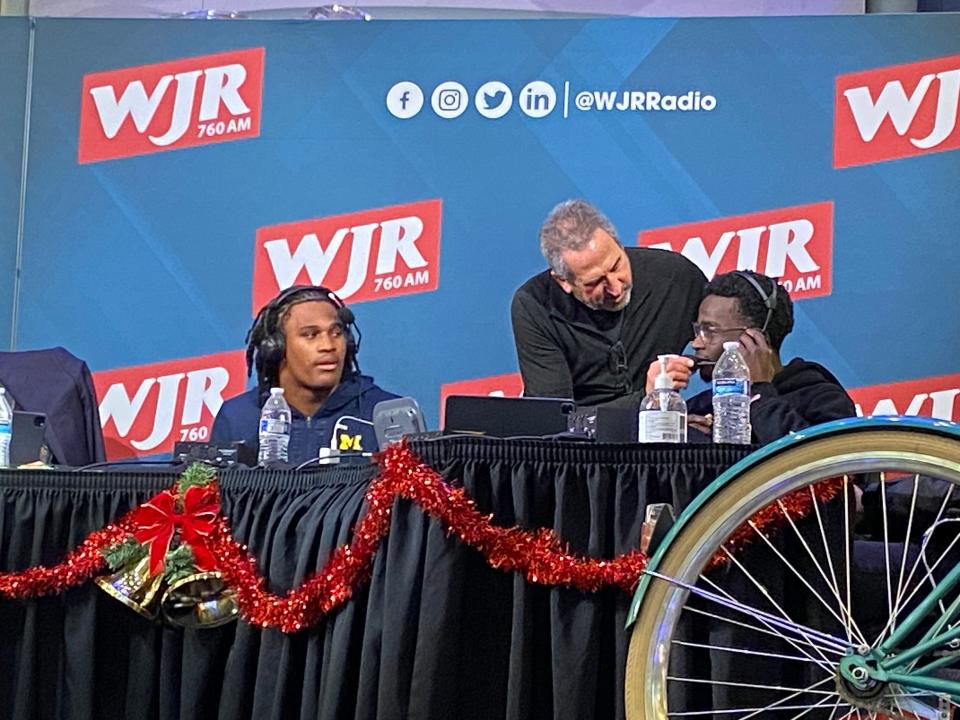 Michigan linebacker Junior Colson, left, and defensive back Mike Sainristil, right, speak during the 12th Mitch Albom Radiothon at Somerset Mall in Troy on Thursday, Dec. 7, 2023.