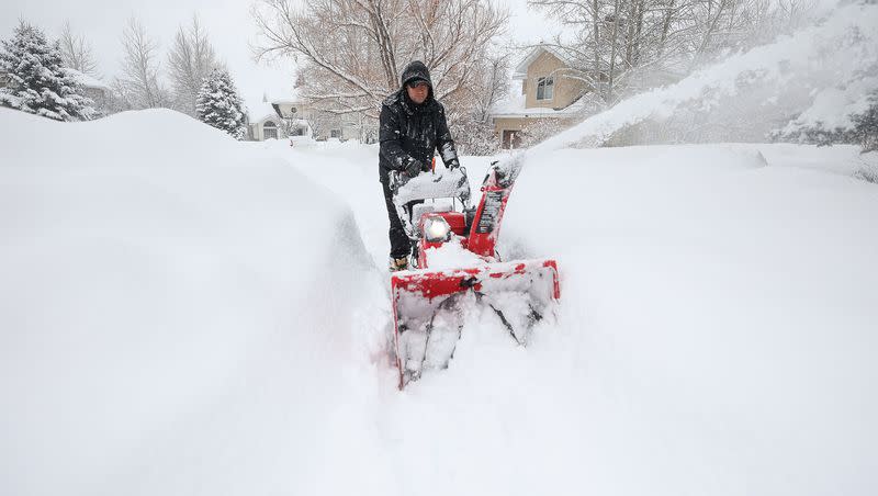 Jesus Carbaj uses a snowblower to clear a sidewalk during a snowstorm in Park City on Wednesday, Jan. 17, 2024.