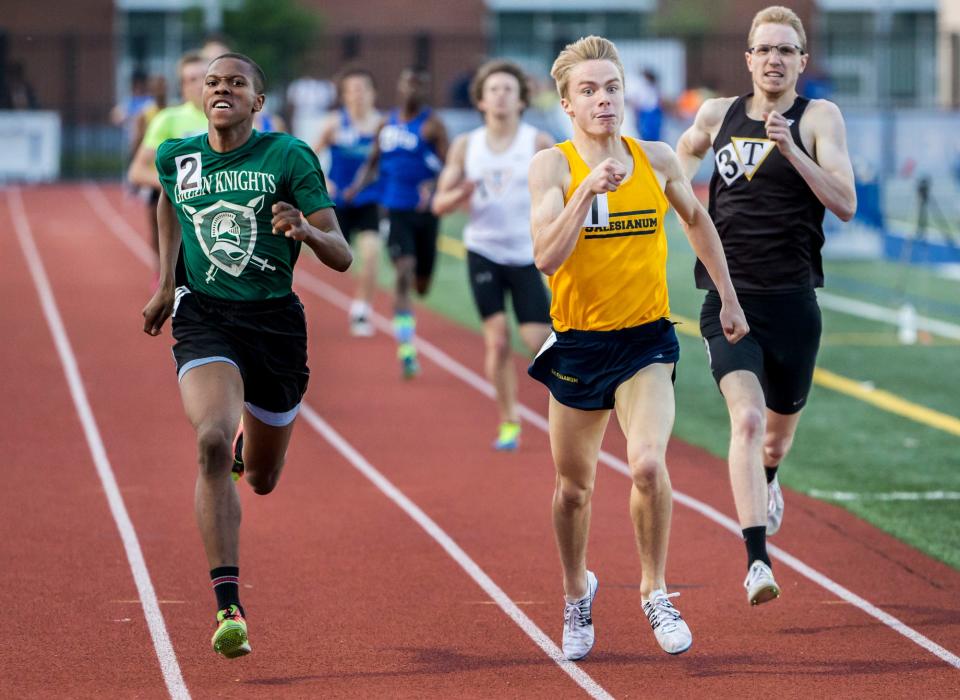 Mt. Pleasant's Johnelle Joe (No. 2) races to the outside of Salesianum's Colin Parker (No. 1) as they race to the finish in the Boys 800 Meter Run event at the Meet of Champions at Dover High School in 2016. Joe finished first over Parker, winning by .05 seconds.