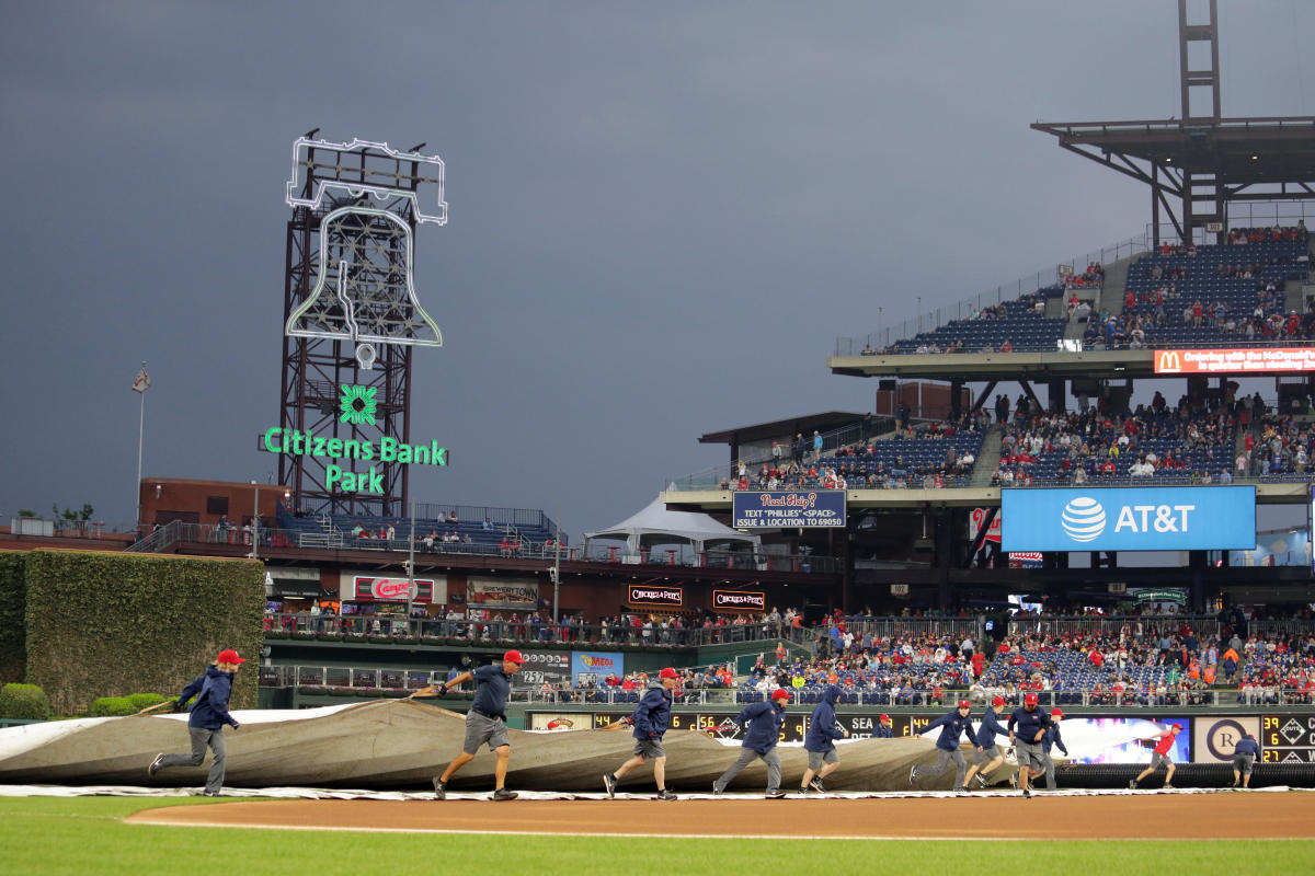 Phillies grounds crew uses blowtorch on field
