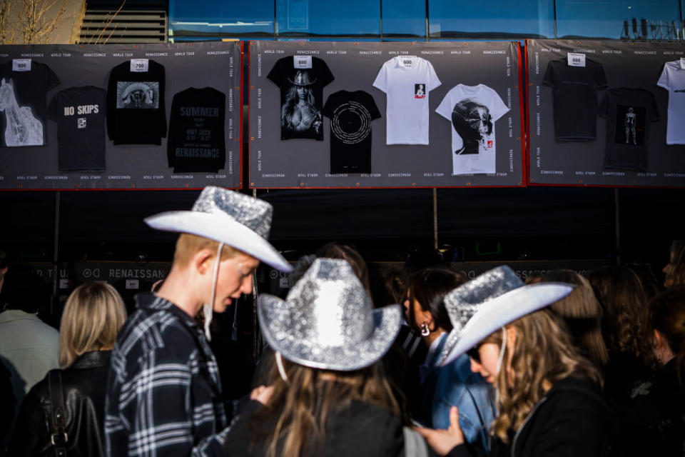 Fans in line for "Renaissance" Tour merch including some wearing sparkly cowboy hats